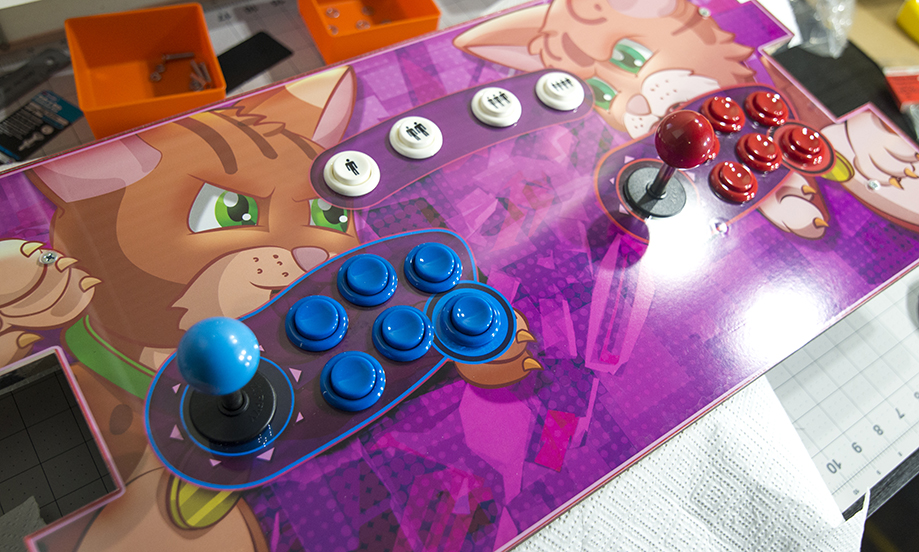 Arcade Cabinet Control Board with inserted buttons and decal artwork