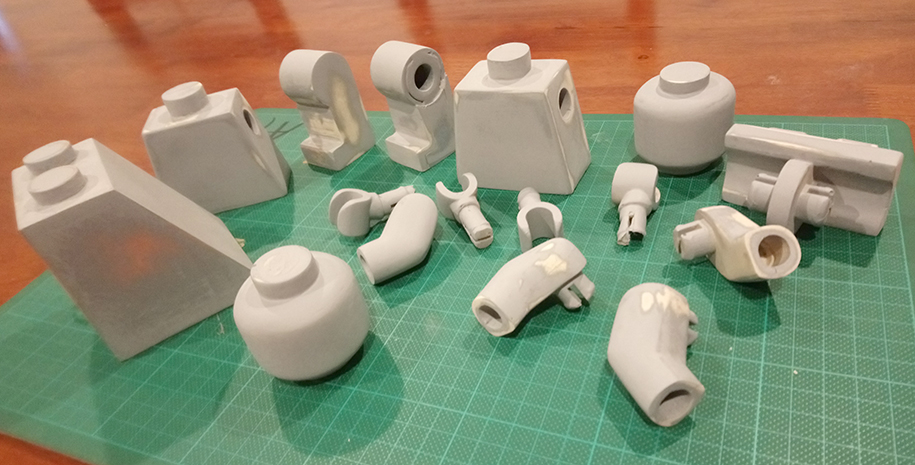 3D printed and cast lego minifigure parts primed